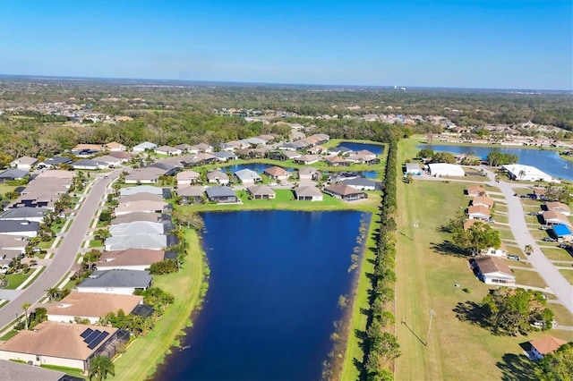 birds eye view of property with a residential view and a water view