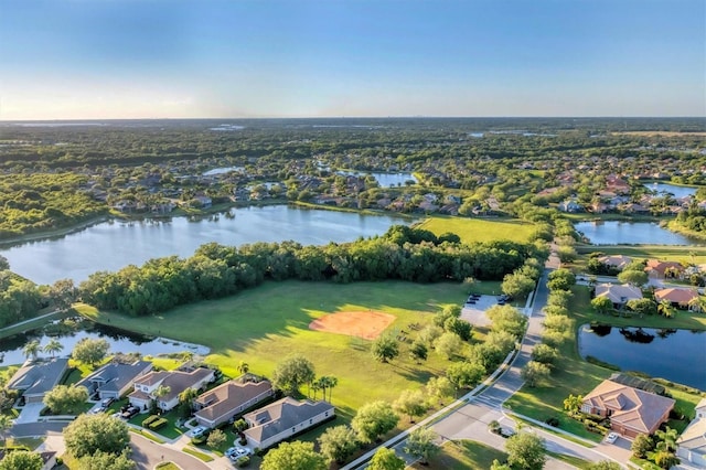 drone / aerial view featuring a residential view and a water view