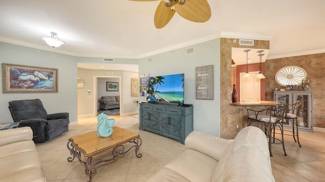 living area with visible vents and ornamental molding