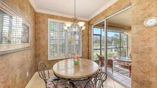 dining area with an inviting chandelier, tile patterned floors, and ornamental molding