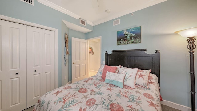 bedroom featuring visible vents, baseboards, a closet, and ornamental molding