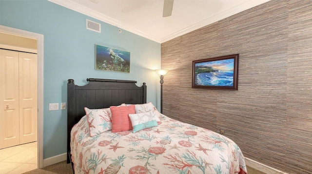 bedroom featuring visible vents, a ceiling fan, crown molding, tile patterned flooring, and baseboards