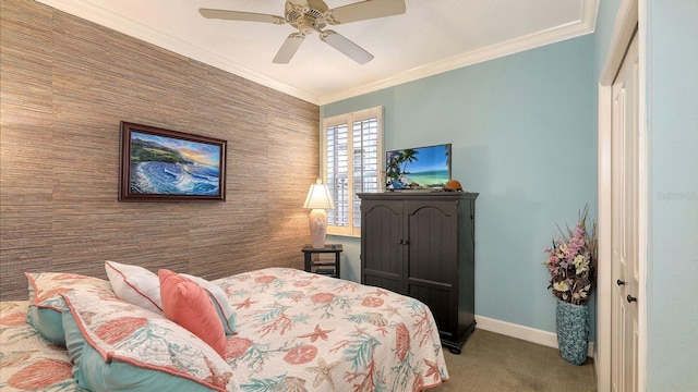 bedroom with baseboards, carpet, ornamental molding, and an accent wall