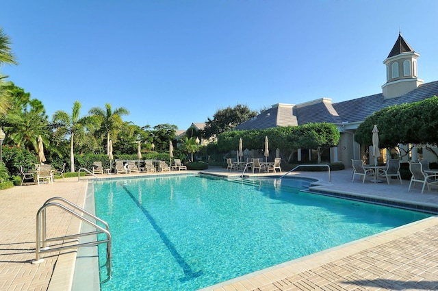 community pool with a patio area