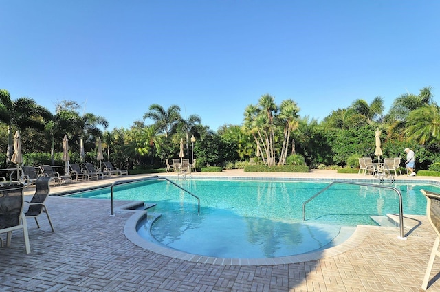 community pool with a patio area