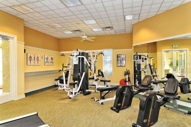 workout area with a wealth of natural light, a ceiling fan, visible vents, and carpet floors