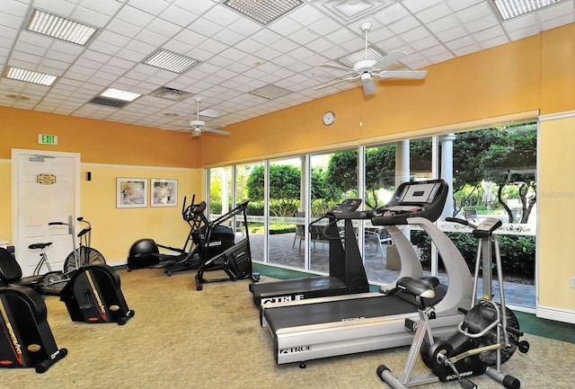 gym with visible vents, baseboards, carpet, and ceiling fan