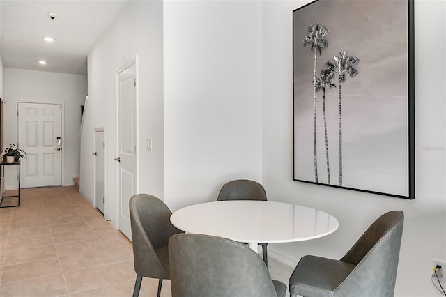 dining space with light tile patterned floors and recessed lighting