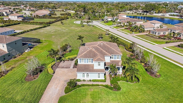 bird's eye view featuring a residential view and a water view