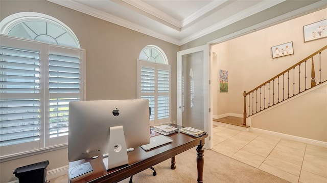 office featuring light tile patterned flooring, a raised ceiling, crown molding, and baseboards