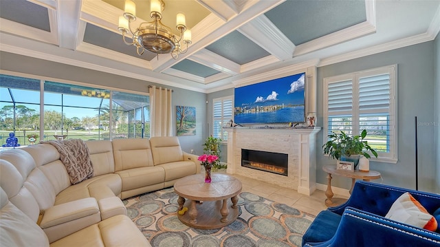 tiled living area featuring a glass covered fireplace, a healthy amount of sunlight, and coffered ceiling