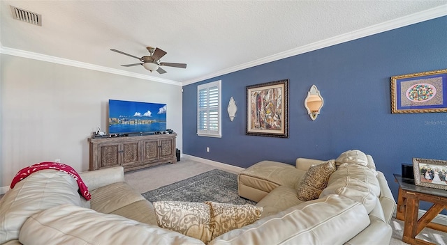 carpeted living area featuring visible vents, crown molding, baseboards, ceiling fan, and a textured ceiling