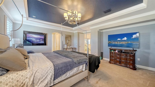 carpeted bedroom featuring a tray ceiling, baseboards, visible vents, and an inviting chandelier