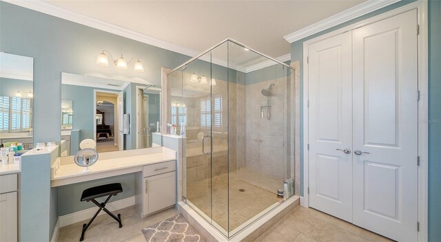 bathroom featuring tile patterned floors, a shower stall, vanity, and ornamental molding