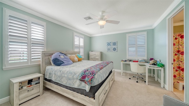 carpeted bedroom with visible vents, ceiling fan, baseboards, and ornamental molding