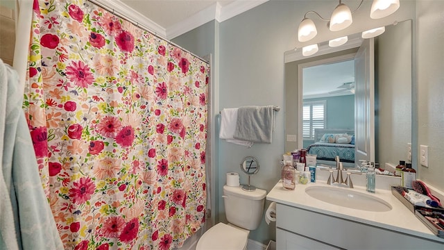 ensuite bathroom featuring vanity, ornamental molding, ensuite bathroom, curtained shower, and toilet