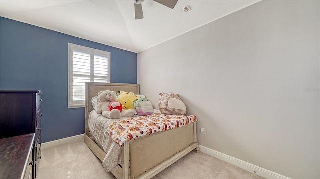 bedroom featuring baseboards, light carpet, lofted ceiling, and a ceiling fan