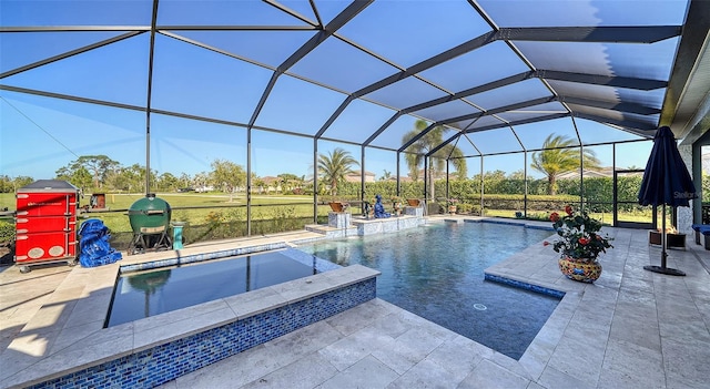 outdoor pool with glass enclosure and a patio area