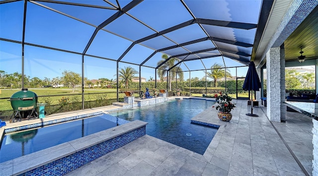 outdoor pool featuring a lanai, a ceiling fan, and a patio area