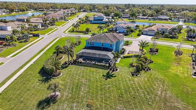 bird's eye view featuring a residential view and a water view