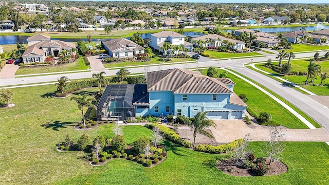 bird's eye view featuring a residential view and a water view