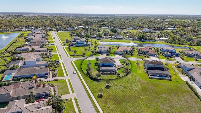 aerial view with a residential view and a water view