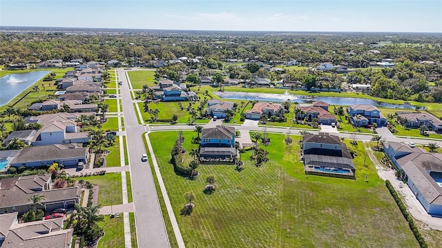 aerial view with a residential view and a water view