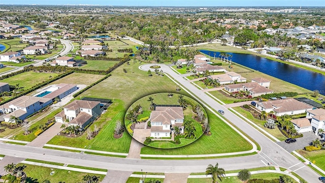 aerial view with a residential view and a water view