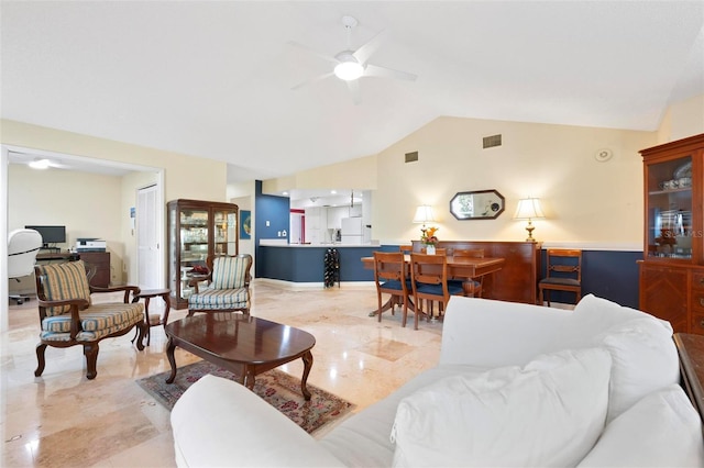 living area with visible vents, lofted ceiling, marble finish floor, and ceiling fan