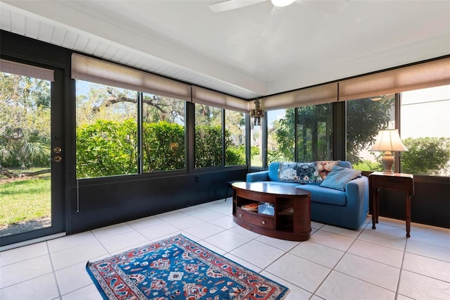 sunroom / solarium featuring ceiling fan