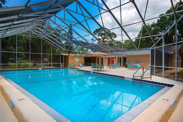 community pool featuring a patio and a lanai