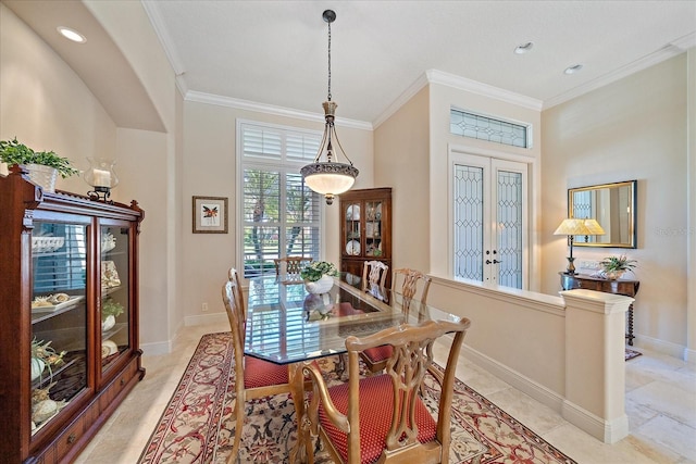 dining area featuring french doors, baseboards, and ornamental molding