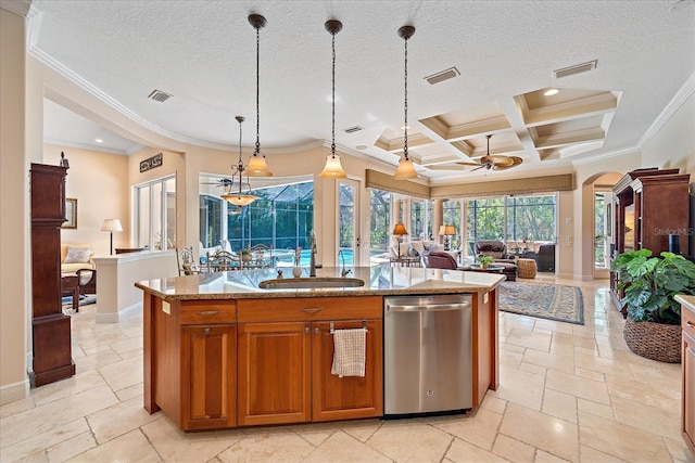 kitchen with a sink, visible vents, dishwasher, and stone tile flooring