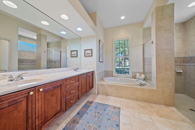 full bath featuring a bath, double vanity, walk in shower, and a sink