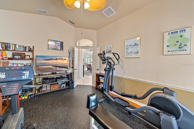 workout room featuring visible vents, ceiling fan, and vaulted ceiling