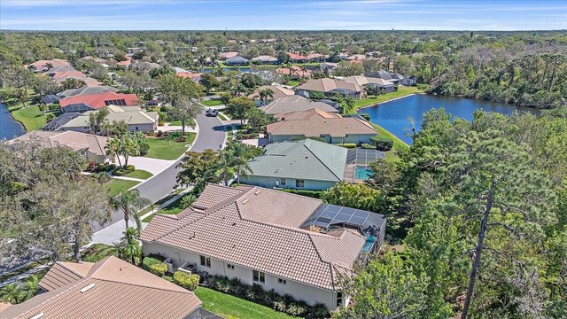 birds eye view of property with a residential view and a water view