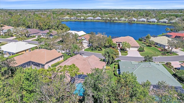 bird's eye view featuring a residential view and a water view