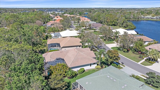 drone / aerial view with a residential view and a water view