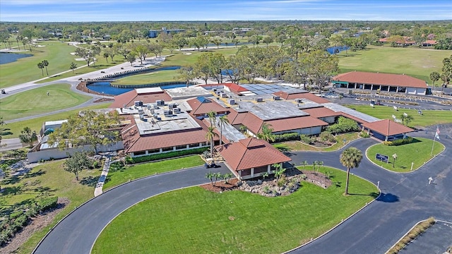 aerial view featuring view of golf course, a water view, and a residential view