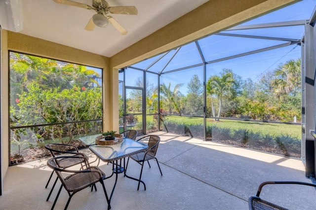 sunroom featuring ceiling fan