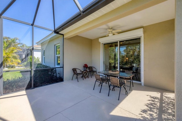 sunroom / solarium featuring a skylight and a ceiling fan