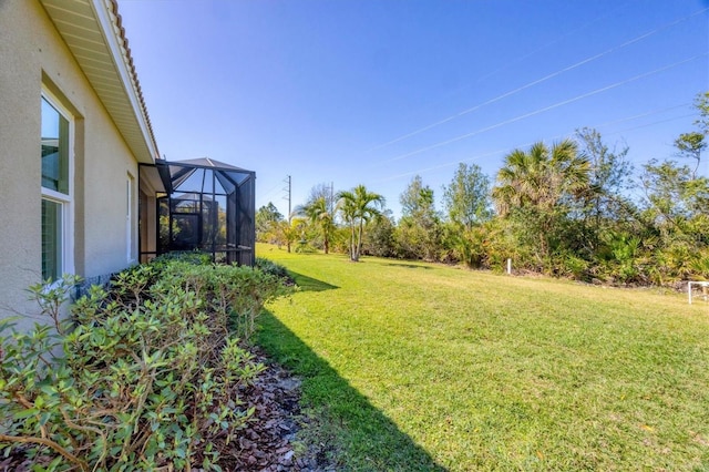 view of yard with a lanai