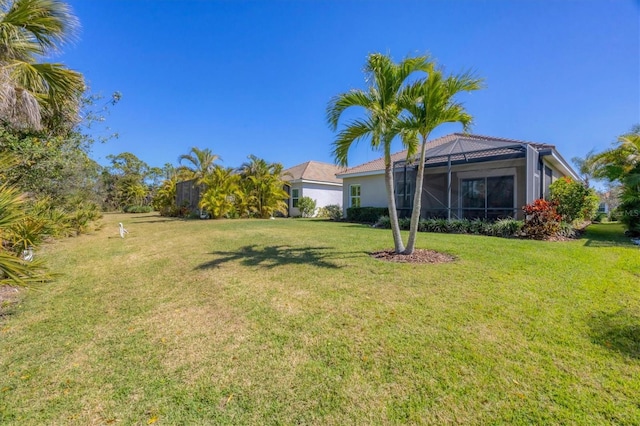 view of yard with a lanai