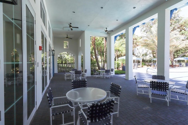 view of patio / terrace with outdoor dining space and a ceiling fan