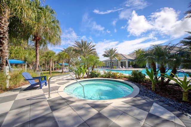 pool featuring a patio area and a hot tub