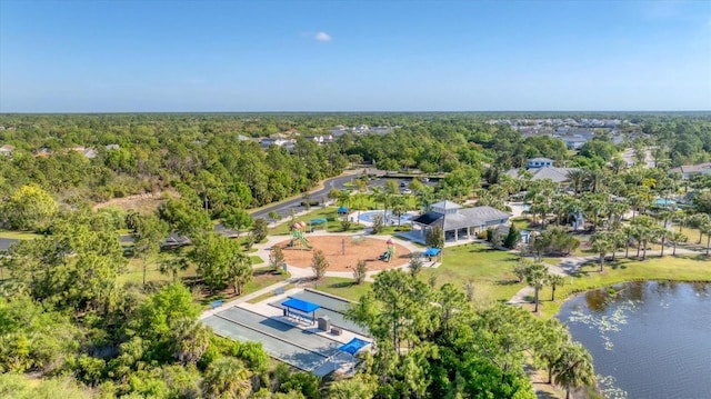 bird's eye view featuring a view of trees and a water view