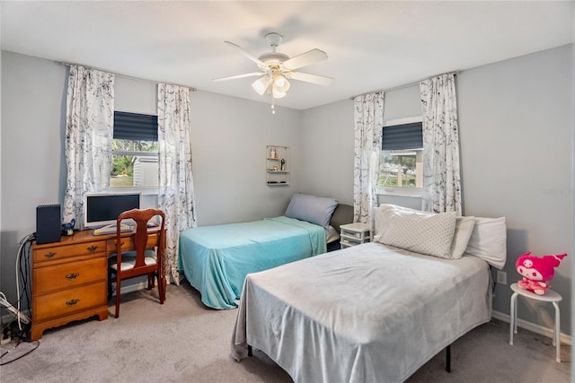 bedroom with baseboards, a ceiling fan, and carpet flooring