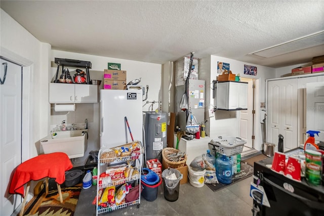 kitchen with electric water heater, concrete floors, heating unit, a textured ceiling, and a sink