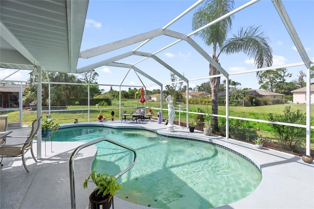 outdoor pool featuring a yard, a patio, and a lanai