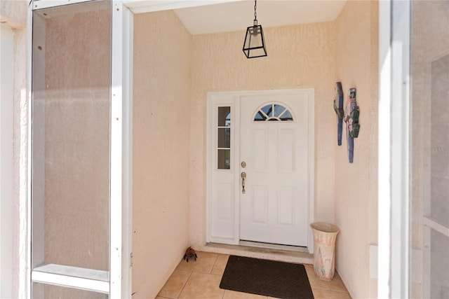 property entrance with stucco siding